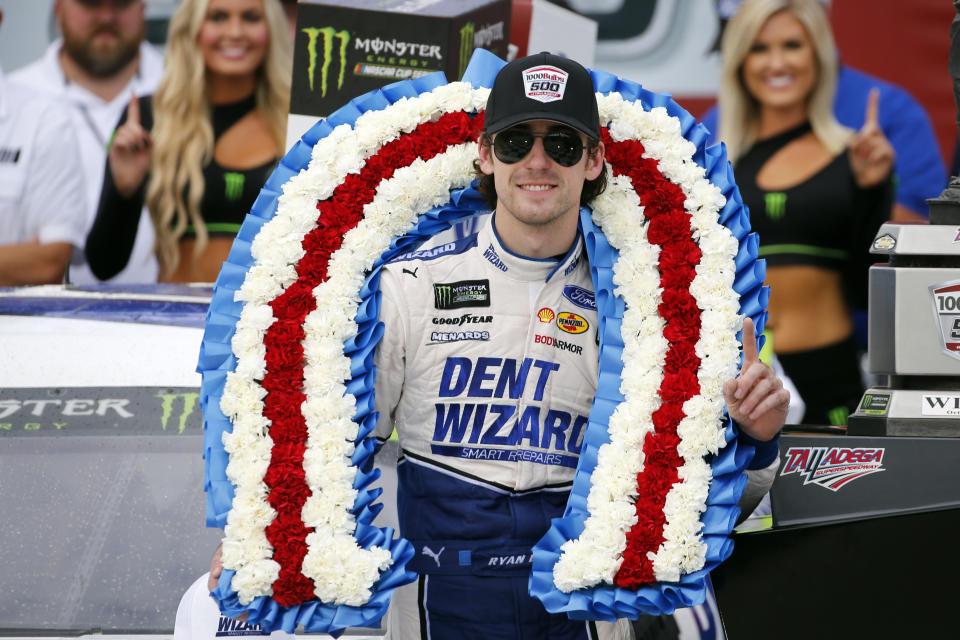 Ryan Blaney celebrates in Victory Lane after winning a NASCAR Cup Series auto race at Talladega Superspeedway, Monday, Oct 14, 2019, in Talladega, Ala. (AP Photo/Butch Dill)