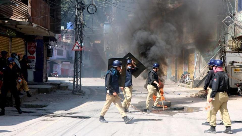 Police clash with demonstrators during a protest against the arrest of committee leaders and activists in overnight raids in Muzaffarabad, Pakistan, 11 May 2024