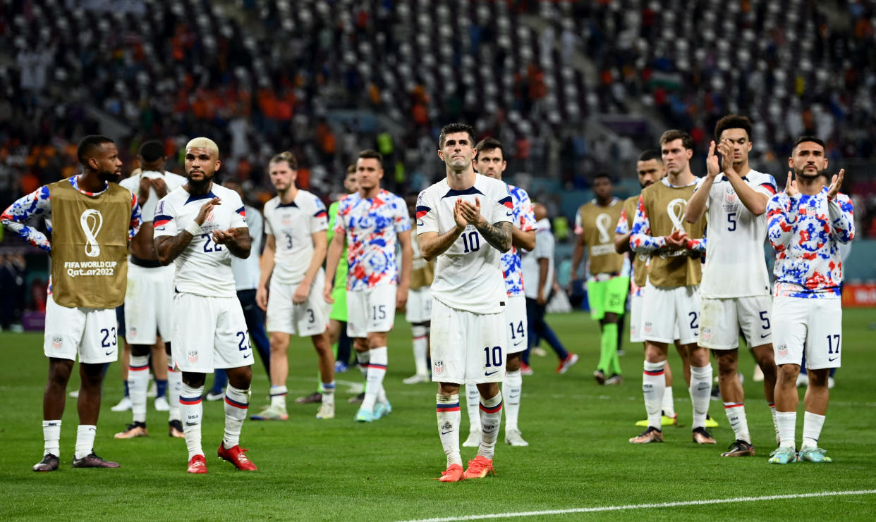 Soccer Football - FIFA World Cup Qatar 2022 - Round of 16 - Netherlands v United States - Khalifa International Stadium, Doha, Qatar - December 3, 2022 United States players applaud fans after the match as United States are eliminated from the World Cup REUTERS/Annegret Hilse