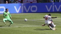 England's Raheem Sterling, right, kicks the ball past Croatia's Sime Vrsaljko and Croatia's goalkeeper Dominik Livakovicto, left, score his team's first goal during the Euro 2020 soccer championship group D match between England and Croatia at Wembley stadium in London, Sunday, June 13, 2021. (AP Photo/Catherine Ivill, Pool)