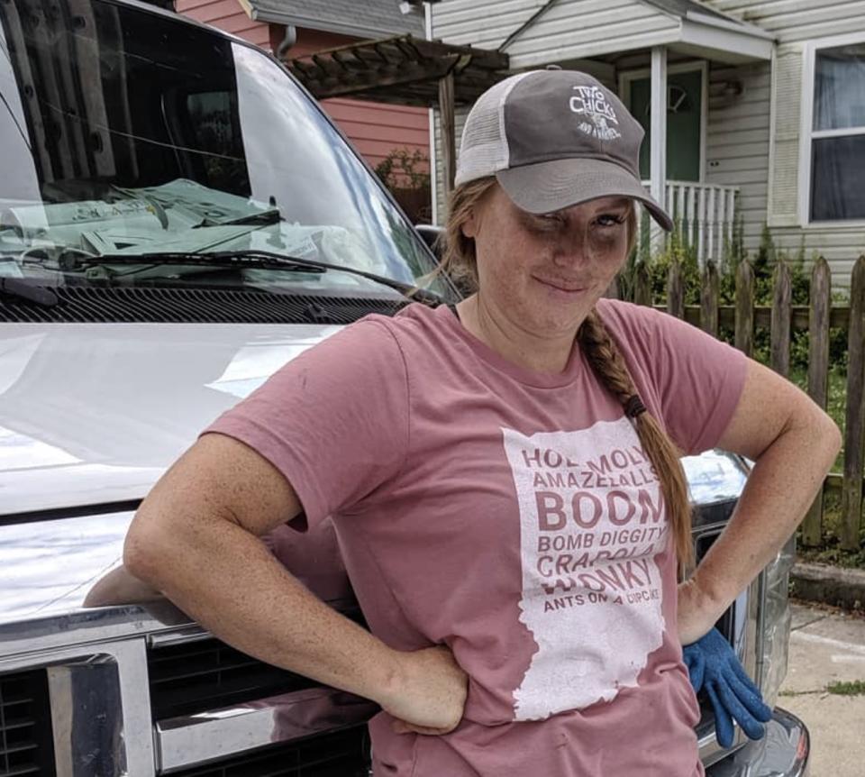 Mina Starsiak Hawk wears baseball hat and red T-shirt