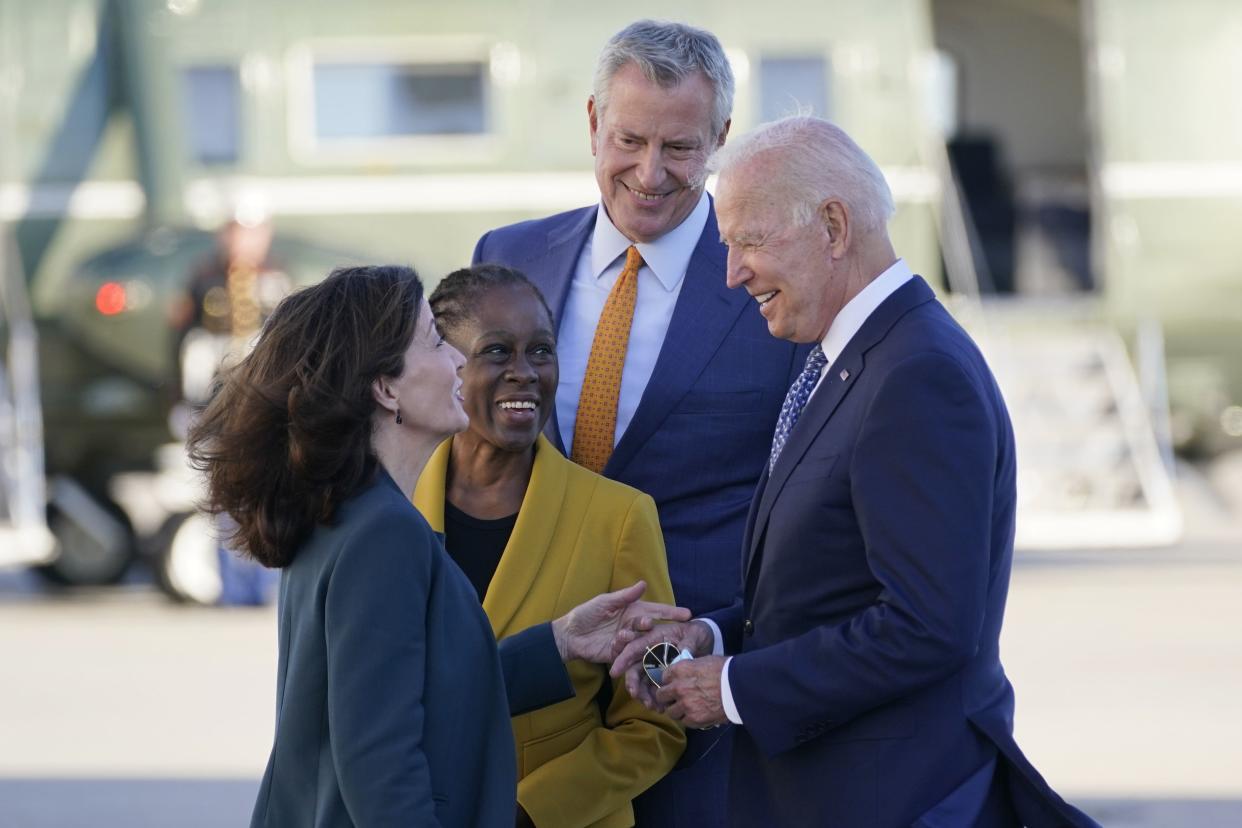 President Joe Biden speaks with New York Gov. Kathy Hochul, left, New York Mayor Bill de Blasio and his wife Chirlane McCray, second left, as he arrives at John F. Kennedy Airport for a two-day visit to attend the United Nations General Assembly, Monday, Sept. 20, 2021, in New York.