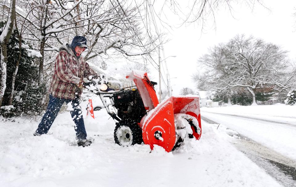 Earl Berwick of East Providence helps clear snow from a neighbor's driveway on Jan 7, 2022. [The Providence Journal / Kris Craig]