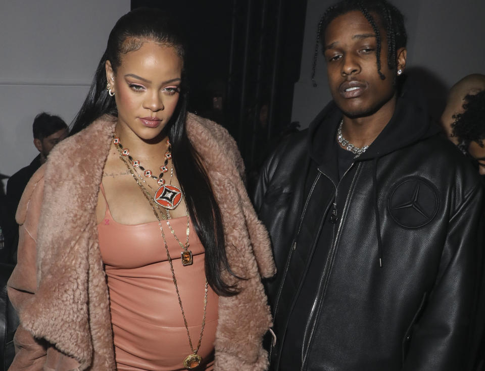 FILE - Rihanna, left, pregnant with her first child, and ASAP Rocky arrive for the Off-White Ready To Wear Fall/Winter 2022-2023 fashion collection, unveiled during the Fashion Week in Paris, on Feb. 28, 2022. Rihanna, who performed at Sunday's Super Bowl game, is expecting her second child. (Photo by Vianney Le Caer/Invision/AP, File)