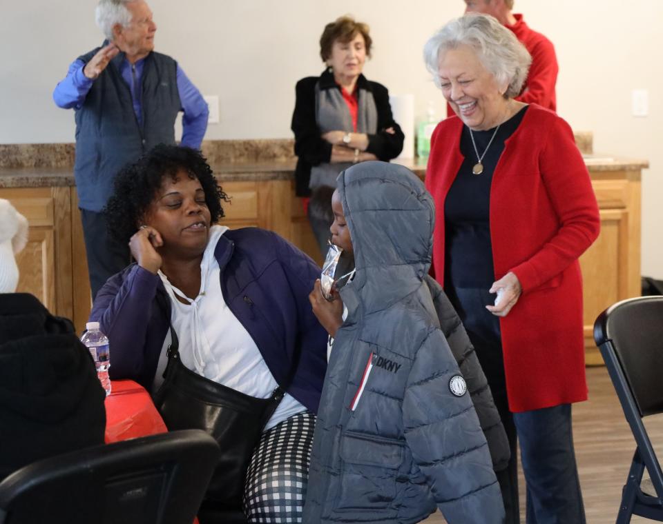 Jeanette Witt (right) shares a moment with Bible study members and others at the opening of First Creek at Austin.