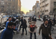 <p>In this photo taken by an individual not employed by the Associated Press and obtained by the AP outside of Iran, people are affected by tear gas fired by anti-riot Iranian police to disperse demonstrators in a protest over Iran’s weak economy, in Tehran, Iran, Saturday, Dec. 30, 2017. (Photo: AP) </p>