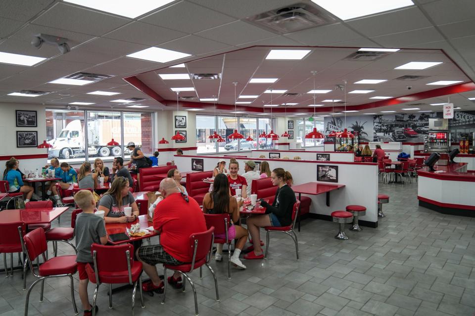 The downtown Indianapolis Steak 'n Shake recently underwent a million-dollar renovation, seen Thursday, June 23, 2022. The restaurant has seven new self-serve ordering kiosks, in addition traditional cash register ordering options, but will no longer offer table service in the dining room. The restaurant also underwent interior and exterior renovations and beautification. 