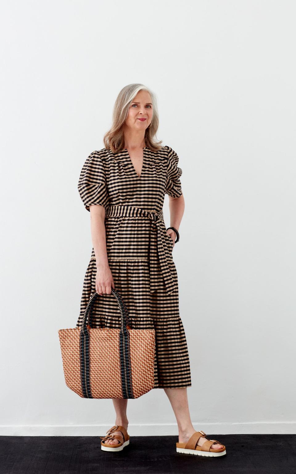 Alyson wears Flora leather sandals, £195, from Grenson; Nadine check dress, £250, Wyse London; Misool leather tote bag, £595, Stelar; Olivera gold vermeil hoop earrings, £115, Auree jewellery; black wood cuff, £21, Branch Jewellery