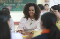 Former U.S. first lady Michelle Obama listens to female students at the Can Giuoc high school in Long An province, Vietnam, Monday, Dec. 9, 2019. Mrs. Obama is on a visit to Vietnam to promote education for adolescent girls. (AP Photo/Hau Dinh)