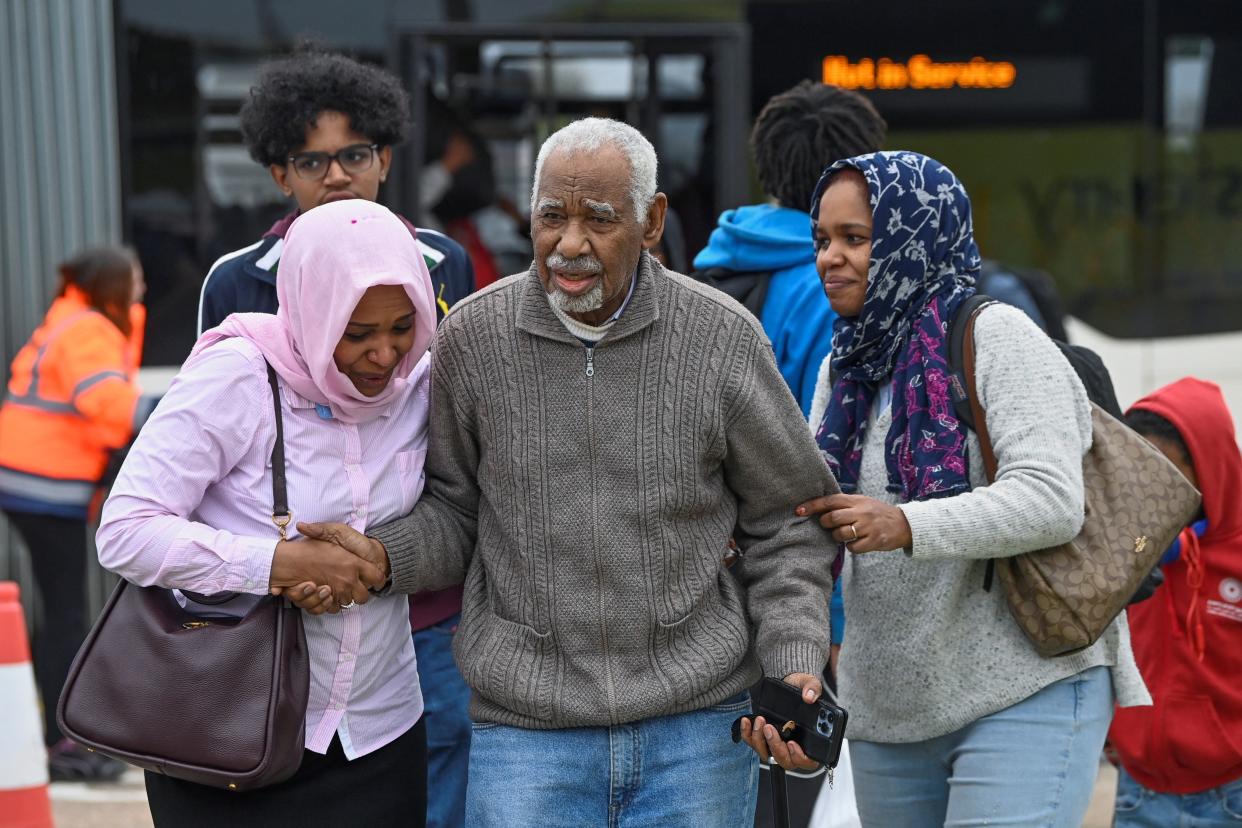 Evacuees, believed to be British nationals, arrive at Stansted Airport following evacuation from Sudan (REUTERS)