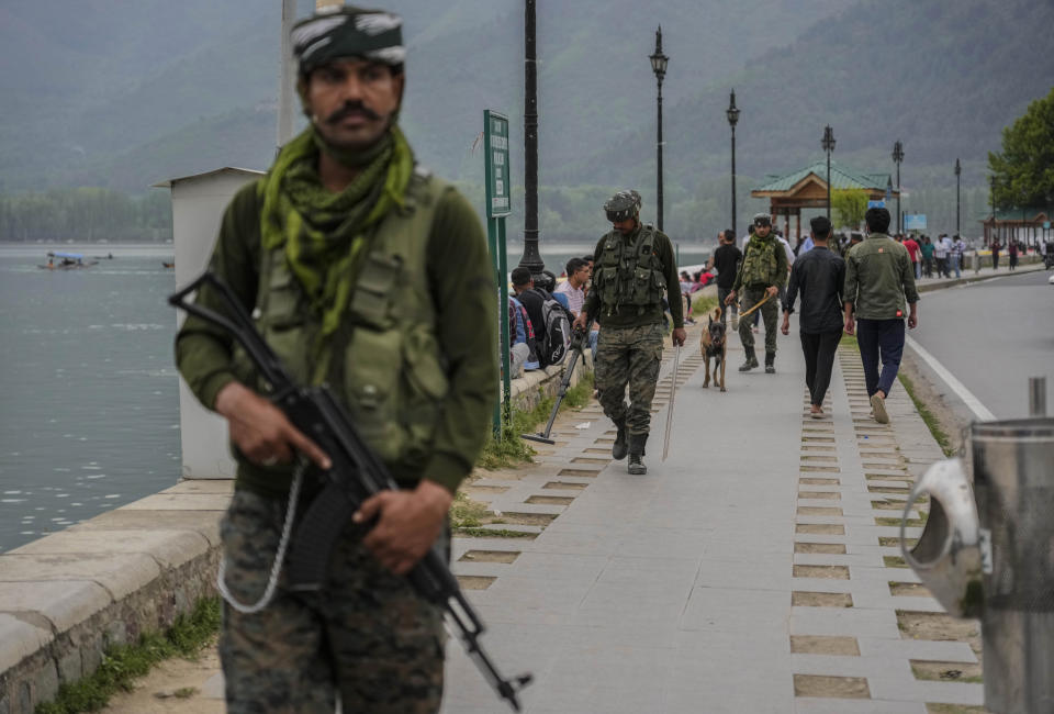 An Indian paramilitary soldiers guard near the Dal Lake ahead of G20 tourism working group meeting in Srinagar, Indian controlled Kashmir, Wednesday, May 17, 2023. Indian authorities have stepped up security and deployed elite commandos to prevent rebel attacks during the meeting of officials from the Group of 20 industrialized and developing nations in the disputed region next week. (AP Photo/Mukhtar Khan)
