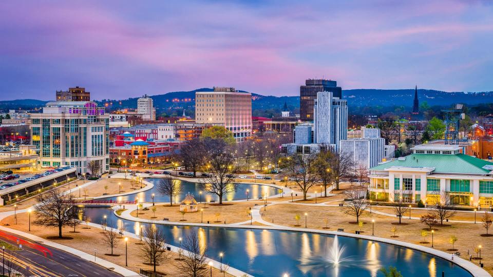 Huntsville, Alabama, USA park and downtown cityscape at twilight.