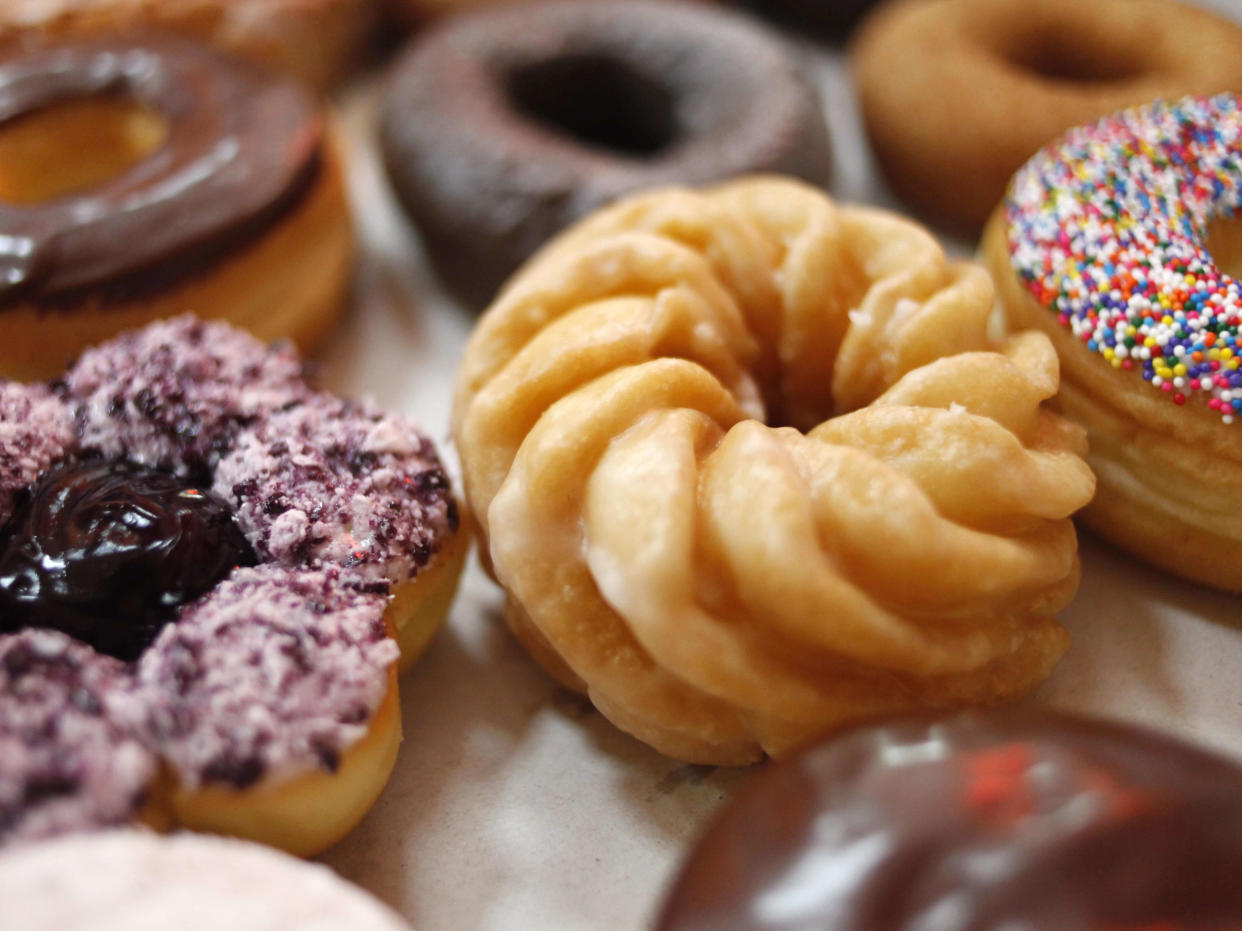 In this July 22, 2009 file photo, Tim Hortons' doughnuts are lined up in a box in New York. The new Tim Hortons Rewards redemption program will be getting a major update in February 2023. (AP Photo/Seth Wenig, File)