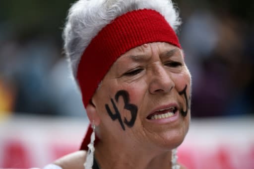 A woman takes part in the Mexico City march over the disappeared students