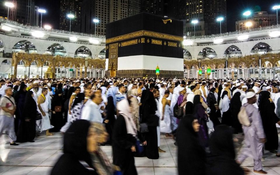 Muslim worshippers circle the Kaaba, Islam's holiest shrine, at the Grand Mosque in Saudi Arabia's holy city of Mecca  - AFP