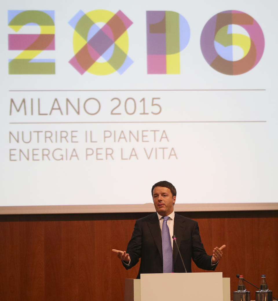 Italian Prime Minister Matteo Renzi delivers his speech during his visit in Milan, Italy, Tuesday, May 13, 2014. Renzi later visited the Expo 2015 construction site, where more than 132 countries will be establishing their pavilions for the world's fair that will open on May 1, 2015 and continue until the end of October of that year. (AP Photo/Antonio Calanni)