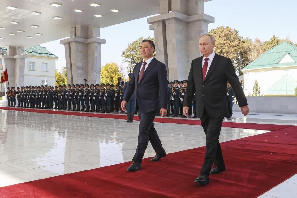 Russian President Vladimir Putin, right, and Kyrgyzstan's President Sadyr Japarov, left, attend a welcome ceremony prior to their talks in Bishkek, Kyrgyzstan, Thursday, Oct. 12, 2023. (Sergei Karpukhin, Sputnik, Kremlin Pool Photo via AP)