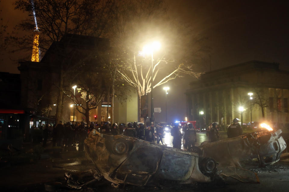 Charred cars are pictured near the Trocadero square after a demonstration Saturday, Dec.1, 2018 in Paris. A protest against rising taxes and the high cost of living turned into a riot Saturday in Paris as police fired tear gas and water cannon in street battles with activists wearing the fluorescent yellow vests of a new movement. (AP Photo/Thibault Camus)