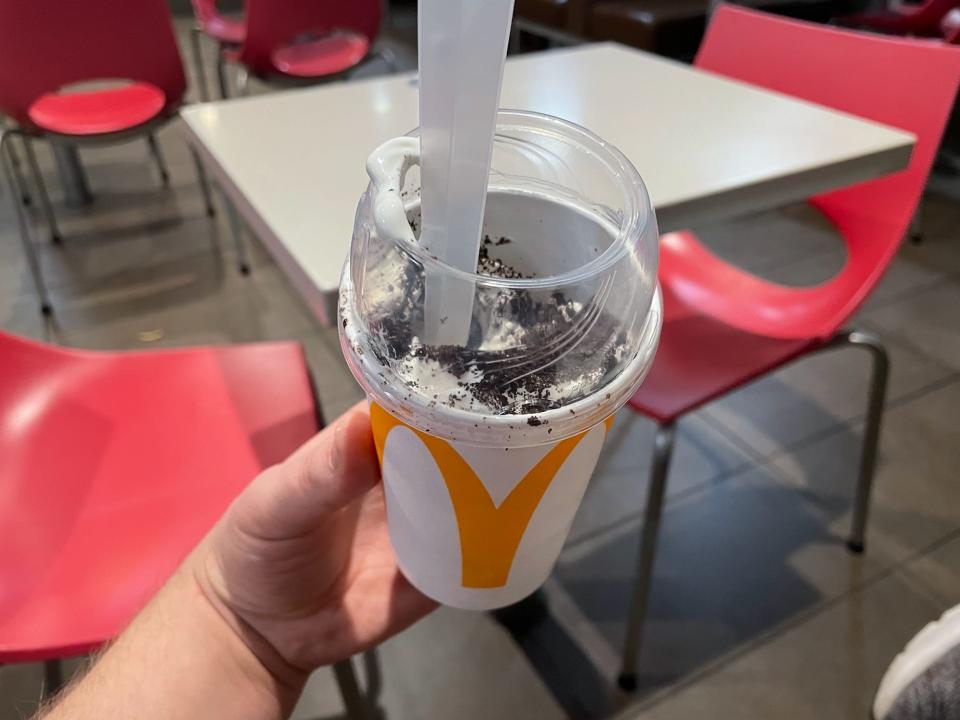 hand holding an oreo mcflurry from mcdonalds