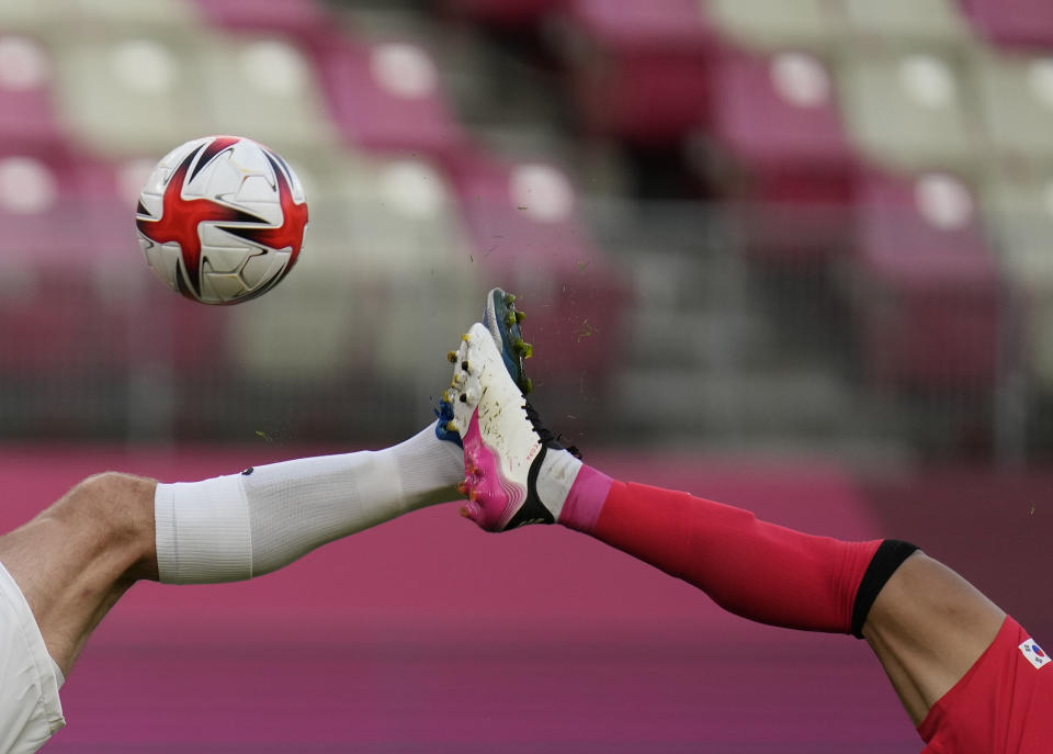 South Korea's Won Dujae, right, and New Zealand's Chris Wood battle for the ball during a men's soccer match at the 2020 Summer Olympics, Thursday, July 22, 2021, in Kashima, Japan. (AP Photo/Fernando Vergara)