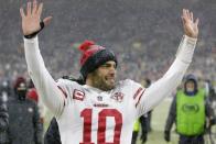 San Francisco 49ers' Jimmy Garoppolo celebrates after an NFC divisional playoff NFL football game Saturday, Jan. 22, 2022, in Green Bay, Wis. The 49ers won 13-10 to advance to the NFC Chasmpionship game. (AP Photo/Matt Ludtke)