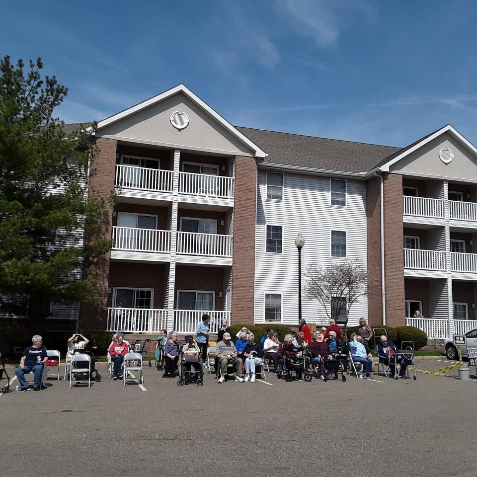 Residents of Danbury Senior Living in North Canton gather to celebrate Monday's total solar eclipse celebration.