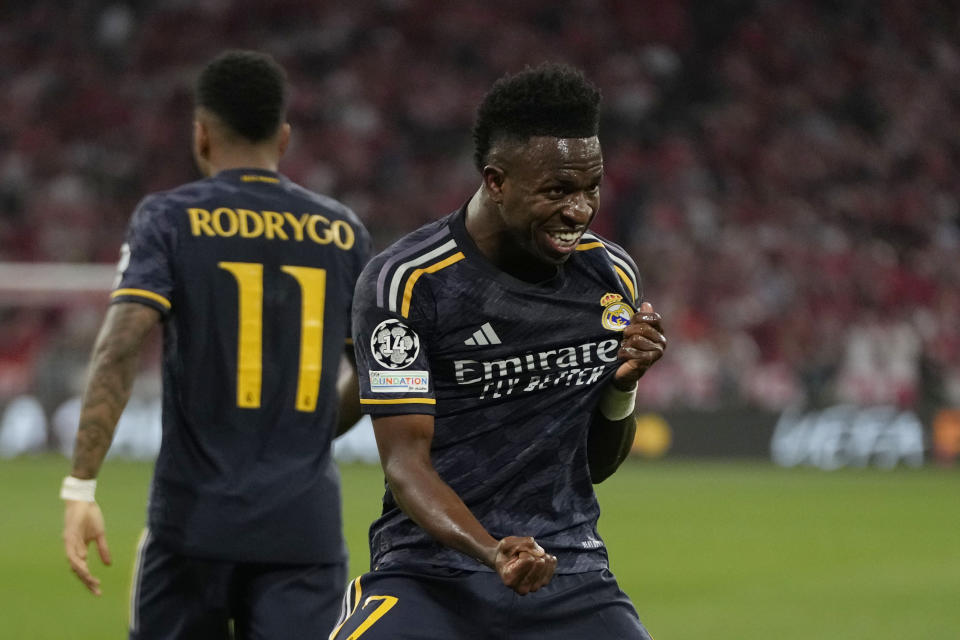 Real Madrid's Vinicius Junior celebrates after scoring his side's opening goal during the Champions League semifinal first leg soccer match between Bayern Munich and Real Madrid at the Allianz Arena in Munich, Germany, Tuesday, April 30, 2024. (AP Photo/Matthias Schrader)