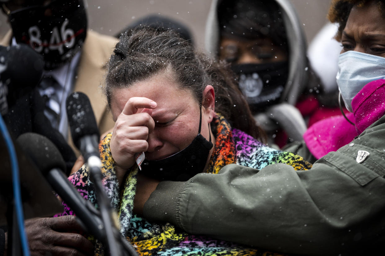 Naisha Wright (R) embraces Katie Wright (C), the mother of Daunte Wright, as she speaks during a press conference outside the Hennepin County Government Center on April 13, 2021 in Minneapolis, Minnesota. (Stephen Maturen/Getty Images)