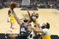 Los Angeles Clippers forward Marcus Morris Sr., left, shoots as Los Angeles Lakers forward Anthony Davis defends during the first half of an NBA basketball game Wednesday, Nov. 9, 2022, in Los Angeles. (AP Photo/Mark J. Terrill)