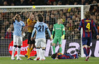 Football - FC Barcelona v Manchester City - UEFA Champions League Second Round Second Leg - The Nou Camp, Barcelona, Spain - 18/3/15 Manchester City's David Silva is shown a yellow card by referee Gianluca Rocchi Action Images via Reuters / Carl Recine Livepic EDITORIAL USE ONLY.