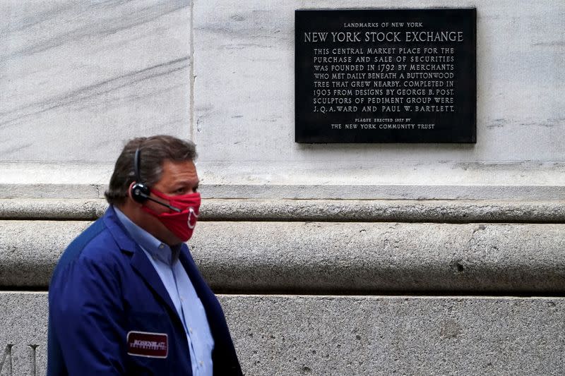 A trader is seen outside the New York Stock Exchange in the Manhattan borough of New York City