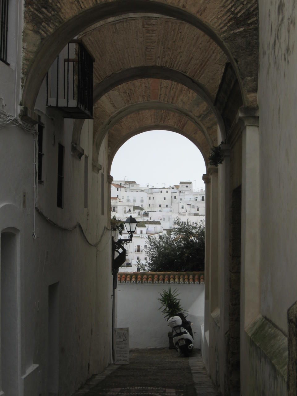 This Jan. 18, 2013 photo shows the tiny, car-free alleys of Vejer de la Frontera, one of Spain's "pueblos blancos," or white villages. The whitewashed houses huddle on a hilltop near the coast where the Mediterranean and the Atlantic meet. (AP Photo/Giovanna Dell’Orto)