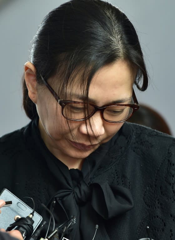 Cho Hyun-Ah, daughter of Korean Air CEO Cho Yang-Ho, is surrounded by journalists outside a Seoul appeals court on May 22, 2015, after she had been jailed for a year in February for disrupting a flight in a rage over macadamia nuts