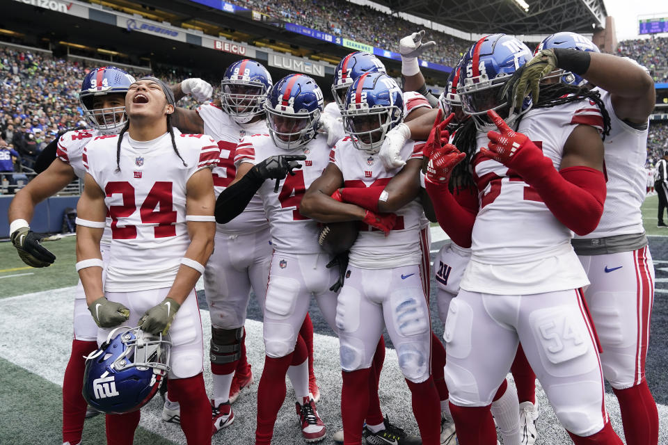 New York Giants cornerback Adoree' Jackson, middle right, celebrates with teammates after recovering a fumble against the Seattle Seahawks during the first half of an NFL football game in Seattle, Sunday, Oct. 30, 2022. (AP Photo/Marcio Jose Sanchez)