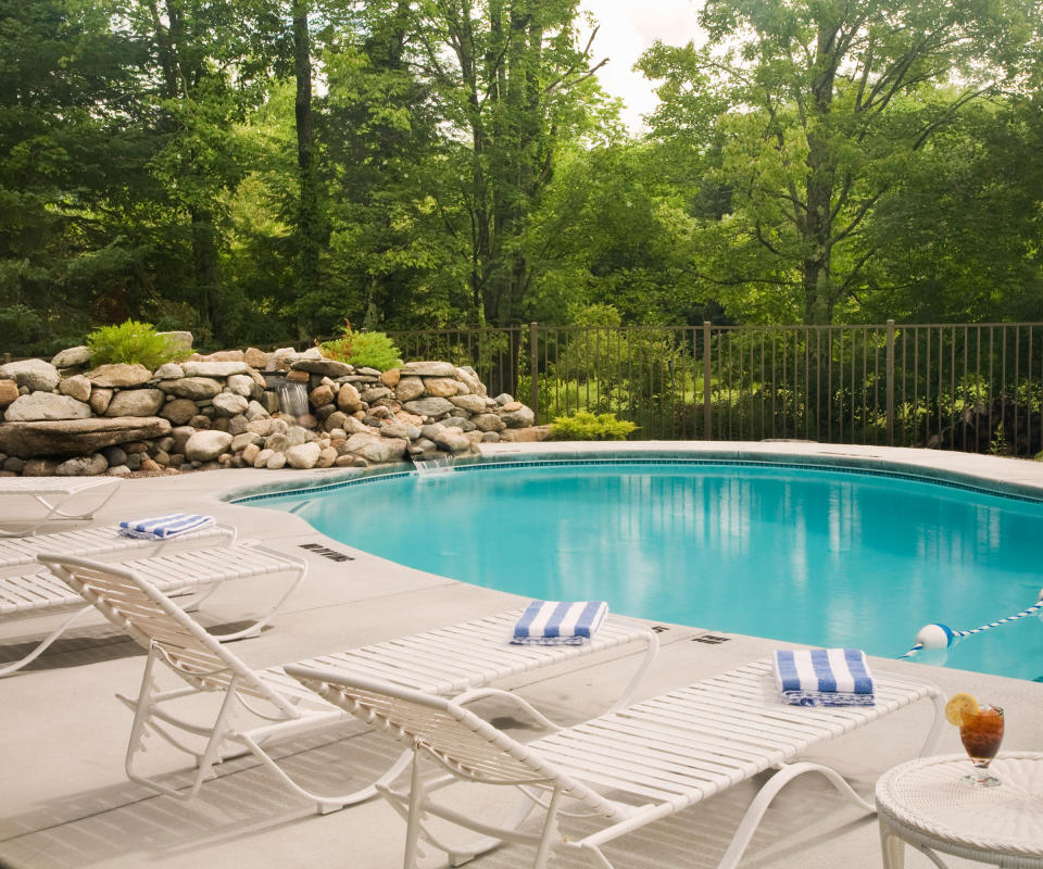 backyard pool with sun loungers