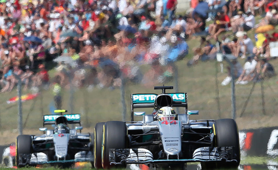 <p>Mercedes driver Lewis Hamilton of Britain leads ahead of Mercedes driver Nico Rosberg of Germany during the Hungarian Formula One Grand Prix at the Hungaroring racetrack near Budapest, Hungary, July 24, 2016. (Photo: Luca Bruno/AP)</p>