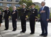 (L-R) Vice Chairman of the Joint Chiefs Adm. Sandy Winnefeld, Navy Secretary Ray Mabus, Chief of Naval Operations Adm. Jonathan Greenert, Chairman of the Joint Chiefs Gen. Martin Dempsey and Defense Secretary Chuck Hagel participate in a ceremony honoring the victims of an attack at the Navy Yard, at the Navy Memorial in Washington, September 17, 2013. Washington authorities questioned on Tuesday how a U.S. military veteran with a history of violence and mental problems could have gotten clearance to enter a Navy base where he killed 12 people before police shot him dead. The suspect, Aaron Alexis, 34, a Navy contractor from Fort Worth, Texas, entered Washington Navy Yard on Monday morning and opened fire, spreading panic at the base just a mile and a half (2.5 km) from the U.S. Capitol and three miles (4.8 km) from the White House. (REUTERS/Mike Theiler)