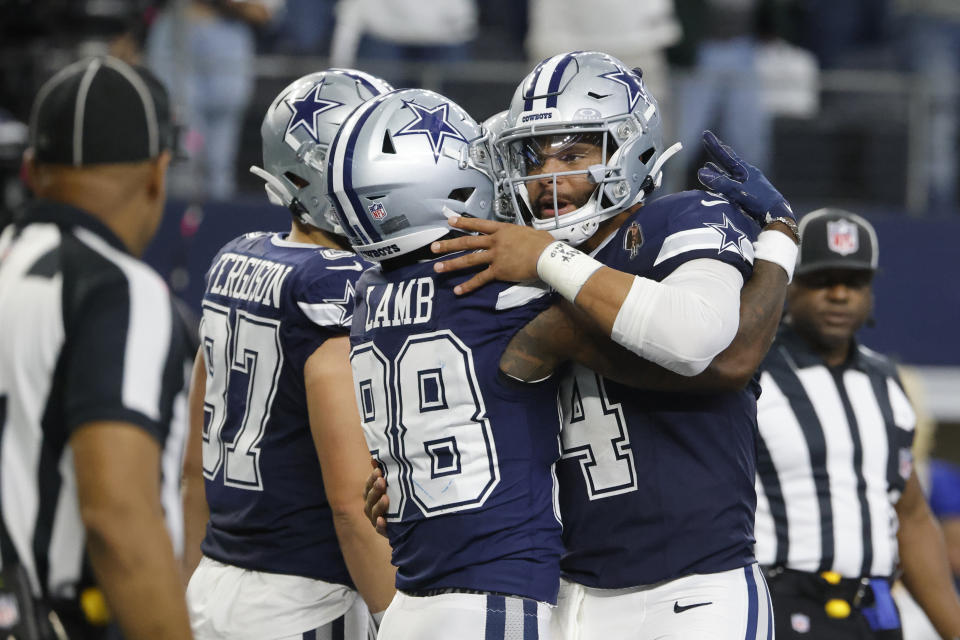 Dallas Cowboys wide receiver CeeDee Lamb (88) and Dallas Cowboys quarterback Dak Prescott (4) celebrate their touchdown during the first half of an NFL football game against the Los Angeles Rams, Sunday, Oct. 29, 2023, in Arlington, Texas. (AP Photo/Michael Ainsworth)