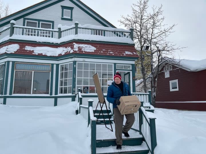 United Way Yukon president David Whiteside leaving the organization's Whitehorse office. He said the COVID-19 pandemic hit the organization hard, that inflation is driving up costs, and donations have been in decline for years. (United Way Yukon - image credit)