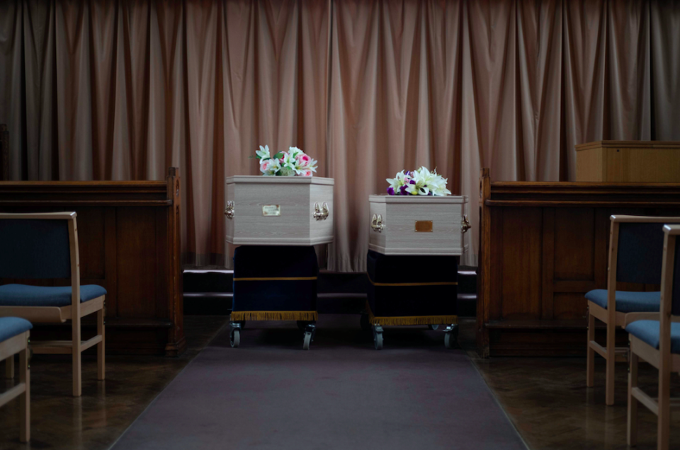 Two coffins of an elderly husband and wife who died from Covid-19 laid side by side at a service in Wilford Hill Crematorium, Nottingham.