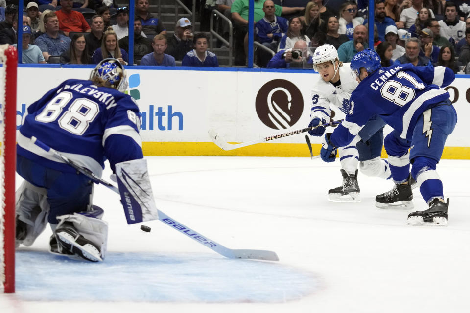 Toronto Maple Leafs right wing William Nylander (88, second from right) prepares to score past Tampa Bay Lightning goaltender Andrei Vasilevskiy (88) during the first period of an NHL hockey game Tuesday, April 11, 2023, in Tampa, Fla. Defending for Tampa Bay is defenseman Erik Cernak (81). (AP Photo/Chris O'Meara)