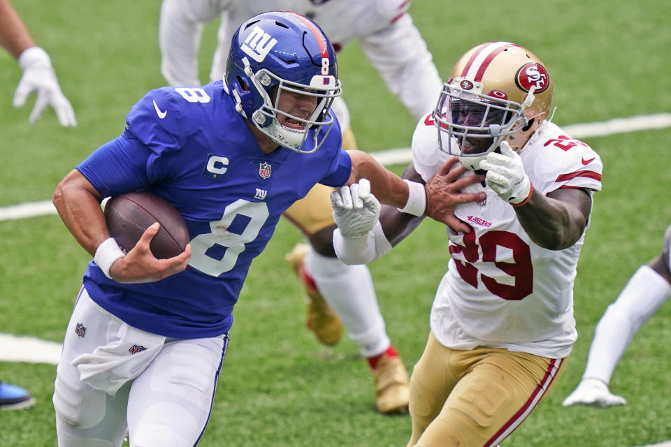 New York Giants quarterback Daniel Jones (8) tries to keep San Francisco 49ers' Jaquiski Tartt away during the second half of an NFL football game, Sunday, Sept. 27, 2020, in East Rutherford, N.J. (AP Photo/Corey Sipkin)