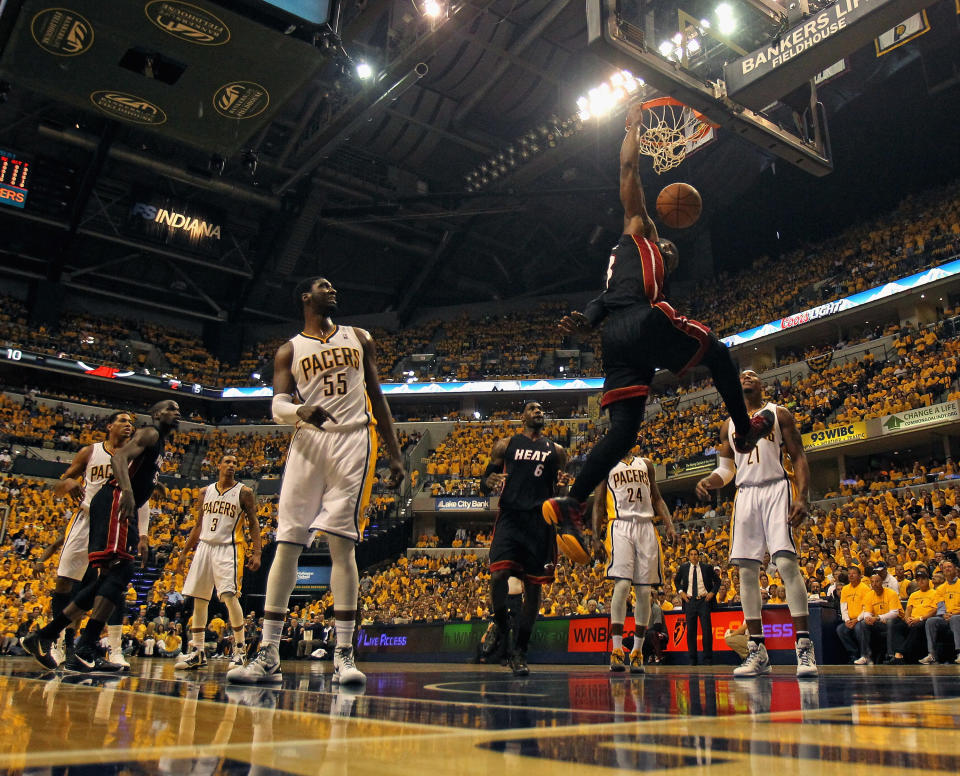 INDIANAPOLIS, IN - MAY 24: Dwyane Wade #3 of the Miami Heat dunks over Roy Hibbert #55 and David West #21 of the Indiana Pacers in Game Six of the Eastern Conference Semifinals in the 2012 NBA Playoffs at Bankers Life Fieldhouse on May 24, 2012 in Indianapolis, Indiana. NOTE TO USER: User expressly acknowledges and agrees that, by downloading and/or using this photograph, User is consenting to the terms and conditions of the Getty Images License Agreement. (Photo by Jonathan Daniel/Getty Images)