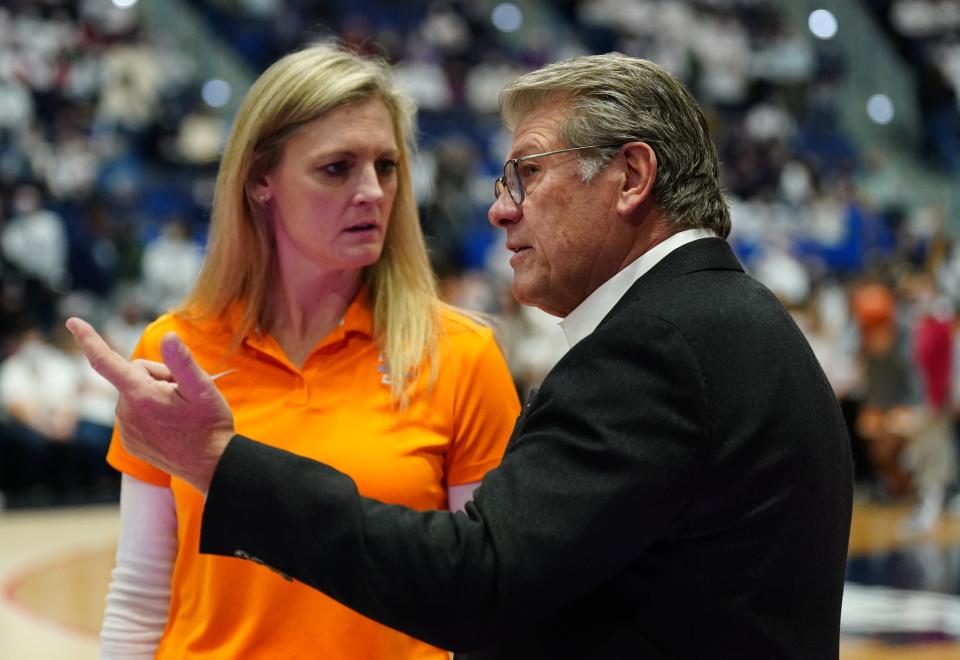 Tennessee coach Kellie Harper (left) talks with UConn's Geno Auriemma ahead of the teams' February 2022 meeting in Hartford.