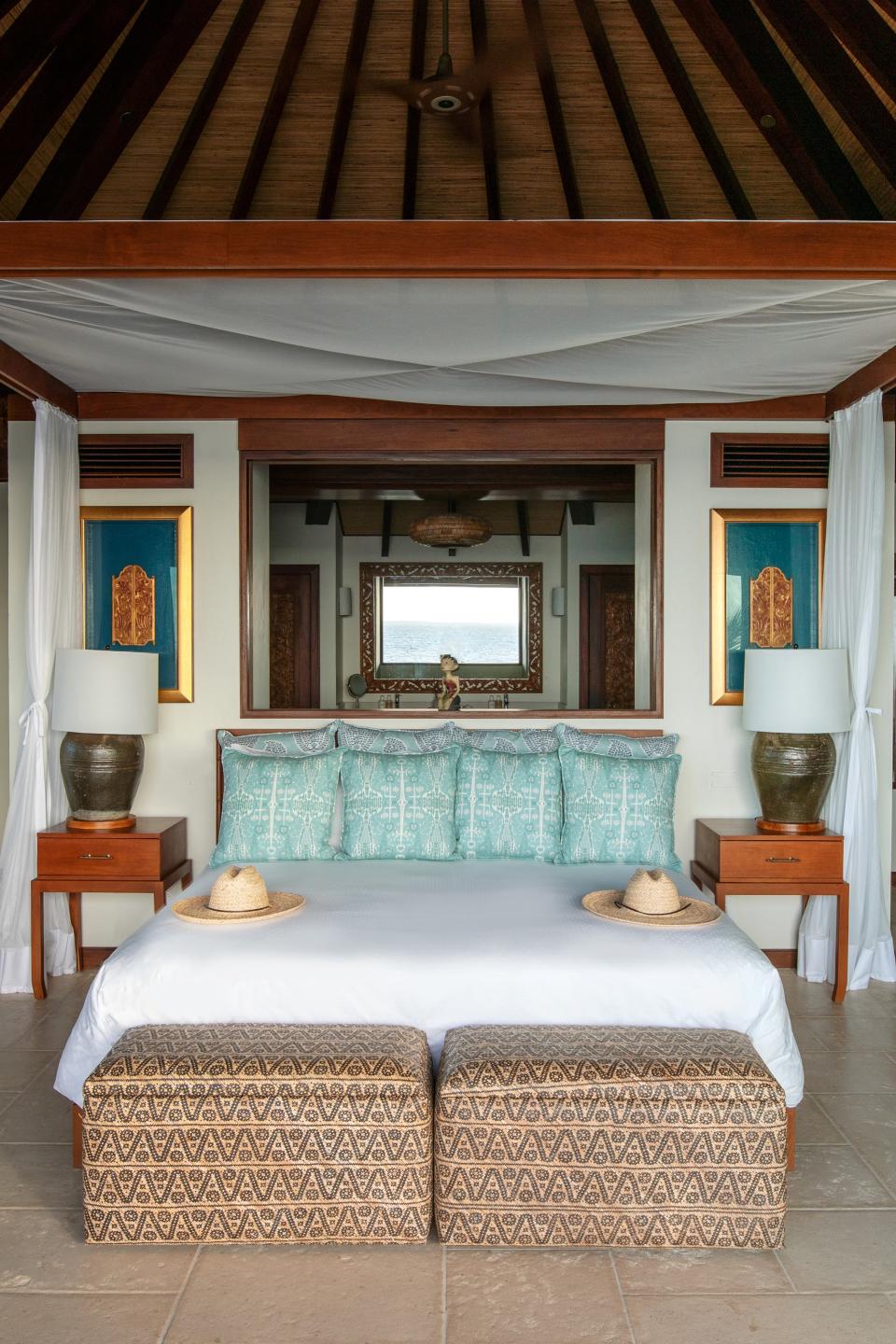 The cliff-face bedroom of Bali High that the writer slept in, decorated with trinkets and hand-carved Balinese decor.