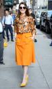 <p>Promoting ‘Oceans 8’, Anne Hathaway was radiant in a patterned pussy-bow blouse, orange skirt and mathcing heels. <em>[Photo: Getty]</em> </p>