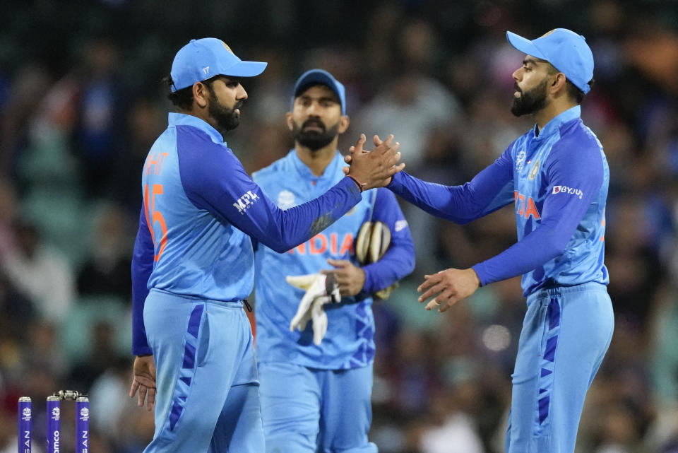 India's Rohit Sharma, left, and Virat Kohli shake hands after the T20 World Cup cricket match between India and the Netherlands in Sydney, Australia, Thursday, Oct. 27, 2022. India defeated the Netherlands by 56 runs. (AP Photo/Rick Rycroft)