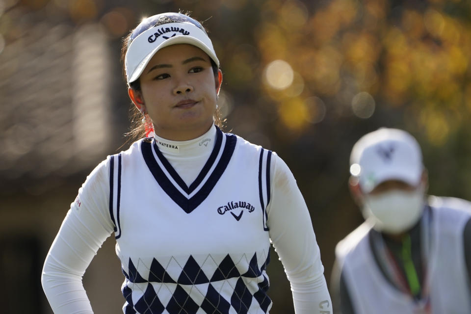 Yui Kawamoto of Japan, reacts to her putt on the fourth green, during the first round of the U.S. Women's Open Golf tournament, Thursday, Dec. 10, 2020, in Houston. (AP Photo/David J. Phillip)