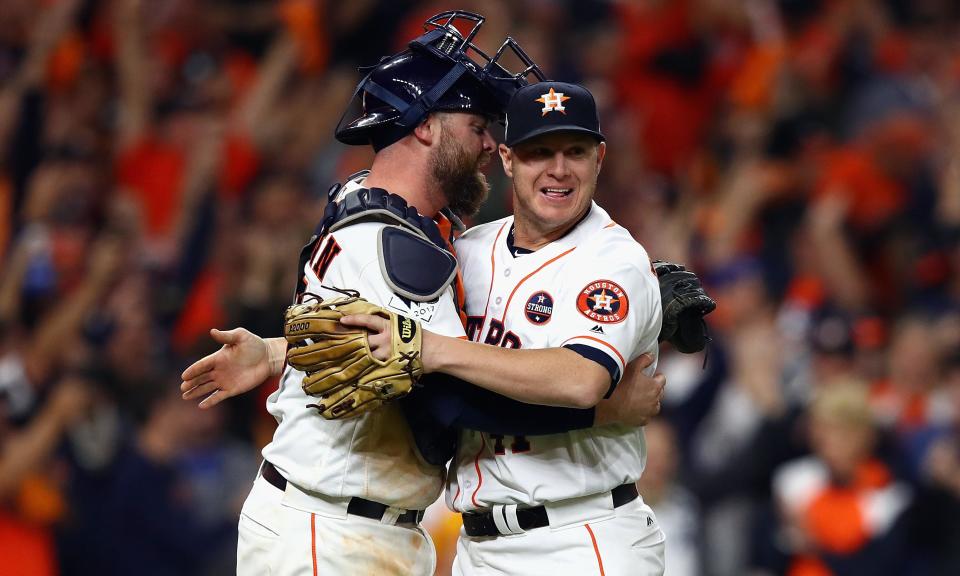 Brad Peacock (right) and Brian McCann celebrate victory in Game 3 of the World Series. (AP)