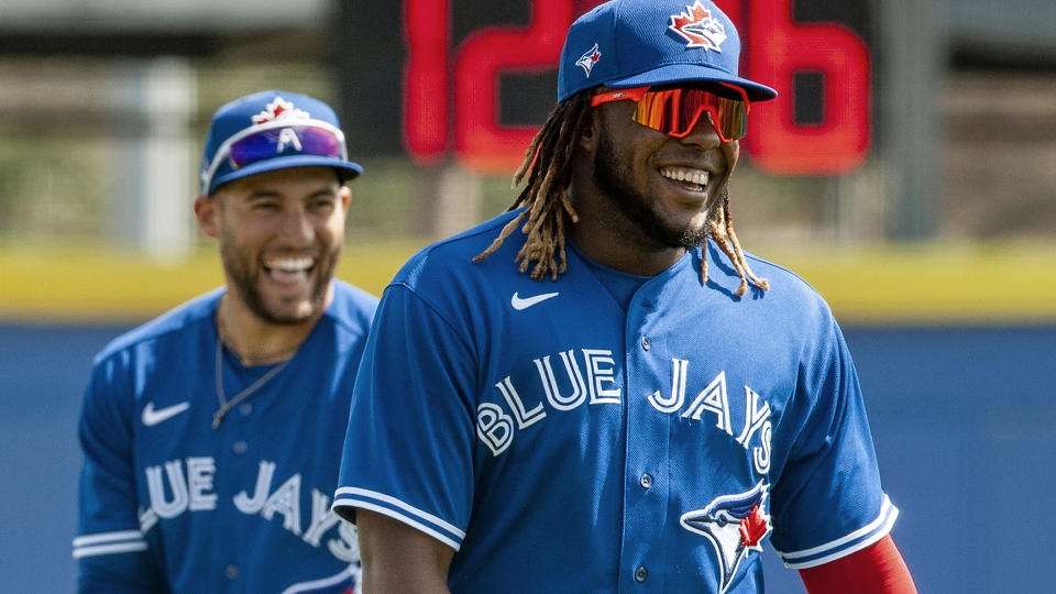 Toronto Blue Jays' Vladimir Guerrero Jr., right, and George Springer share a laugh before a spring training baseball game against the Philadelphia Phillies Tuesday, March 2, 2021, at TD Ballpark in Dunedin, Fla. THE CANADIAN PRESS/Steve Nesius